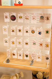 white earring/pin display