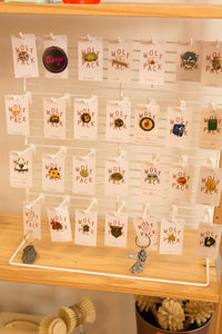 white earring/pin display